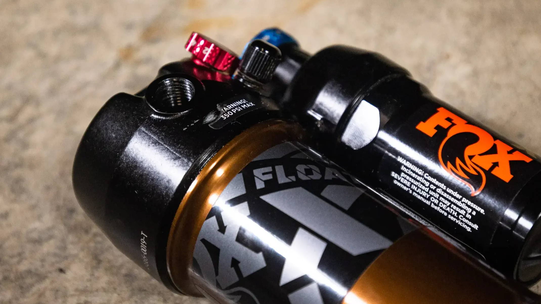 2022 Fox Float X Mountain bike trunnion rear shock on the floor in detail