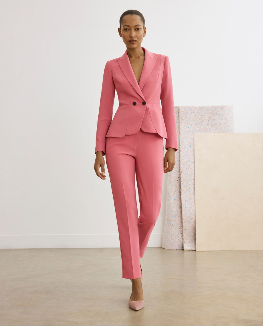 Model wearing geranium pink suiting