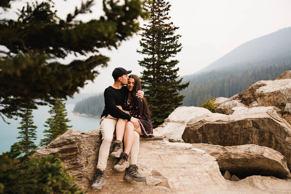engagged couple with banff in background