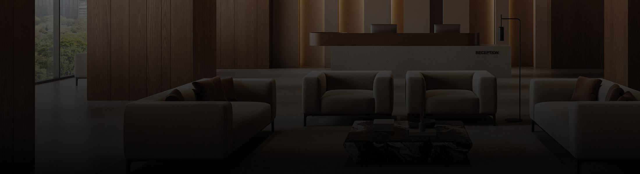 Modern hotel lobby with seating area and reception desk, representing security and monitoring solutions for the hospitality industry