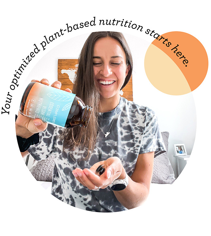 Woman Holding Complement Essentail Vegan Nutrients