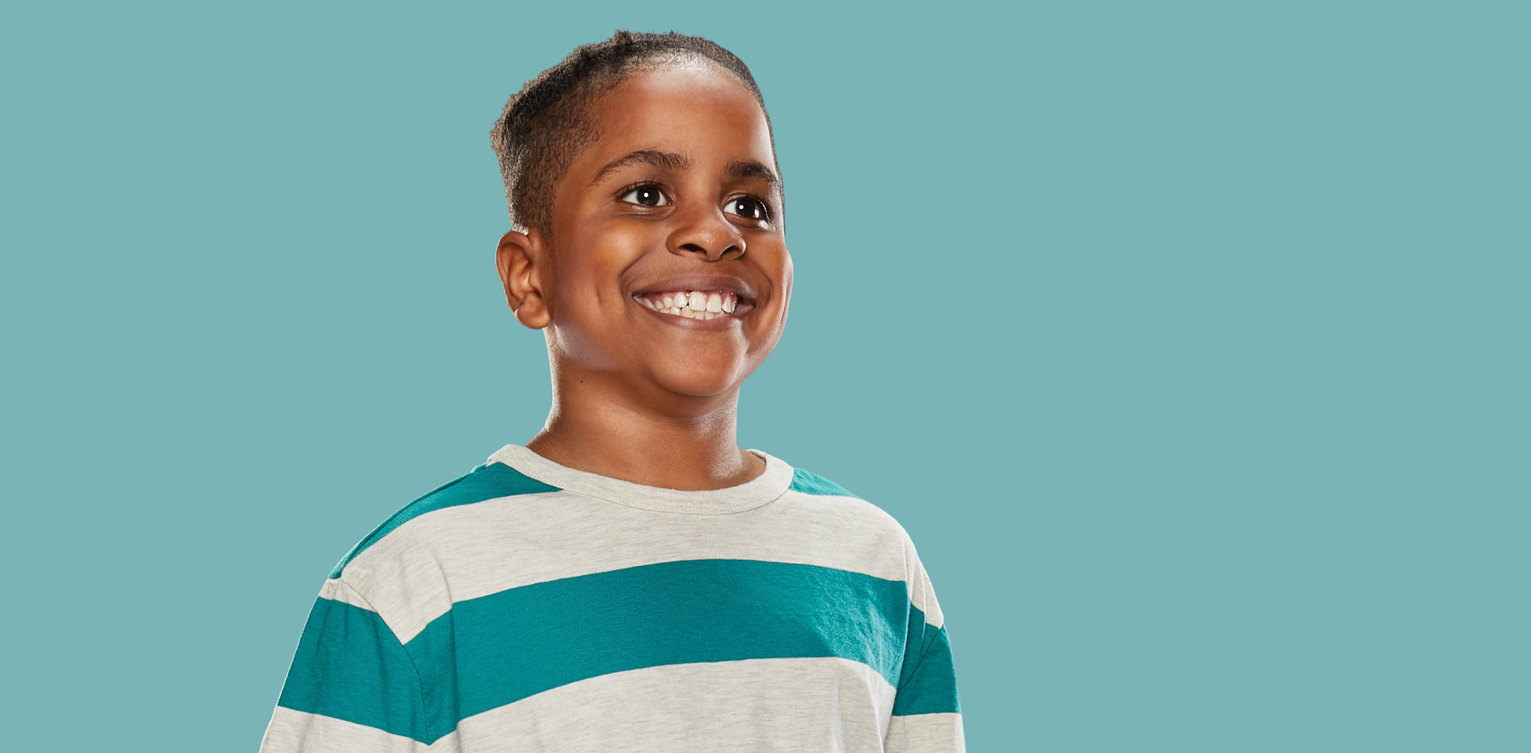 Boy smiling wearing striped t-shirt