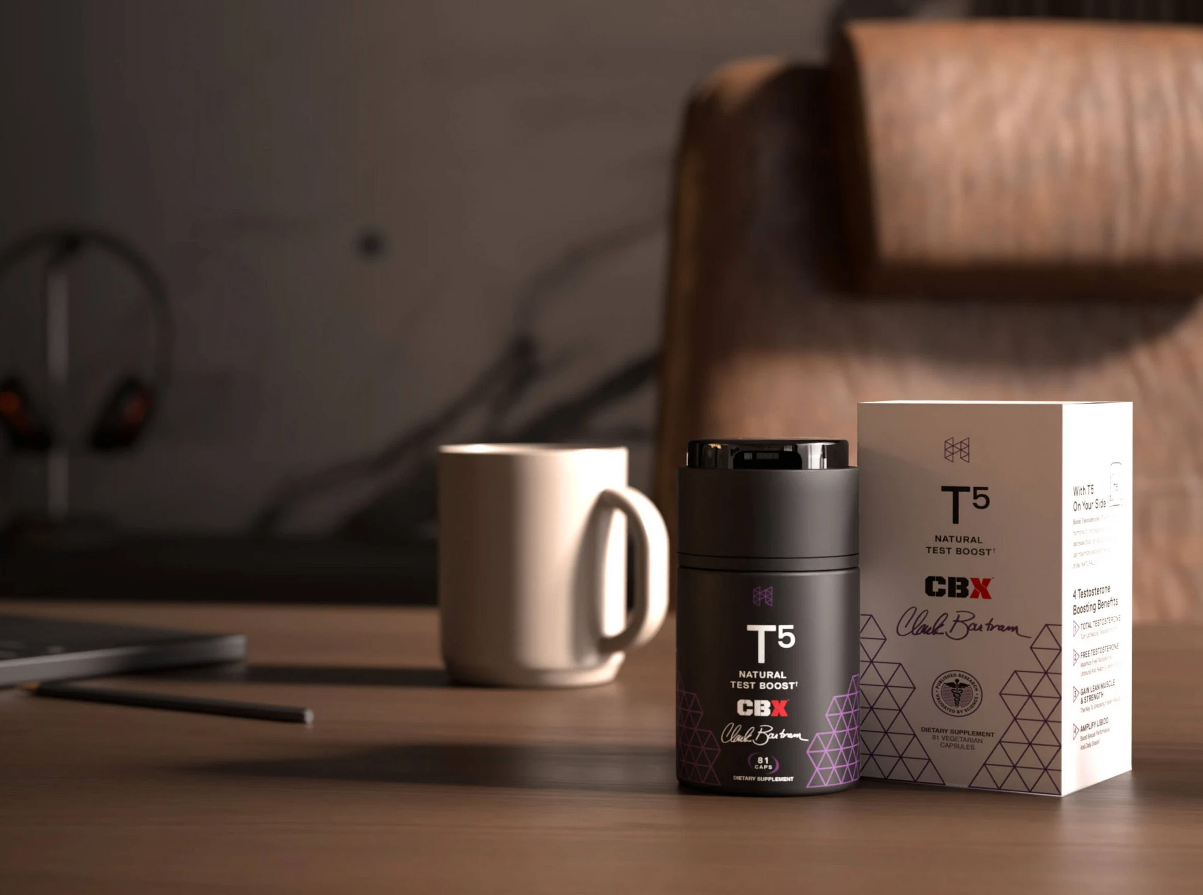 A coffee mug beside a product bottle and box on a table.