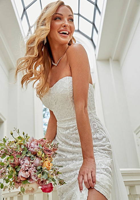 Shop 2023 bridal dresses for the perfect look at all the bride's events with a stunning variety of long sillhouettes in gorgeous fabrications like lace, satin, or sequin, & embellished bridal gowns with beading or rhinestones.