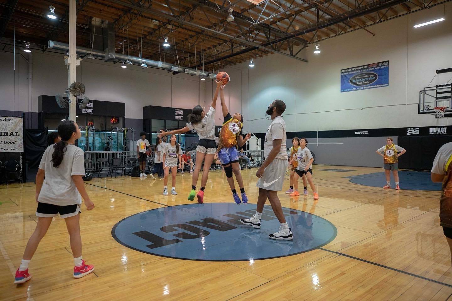 heroes basketball league girls fight for a jump ball
