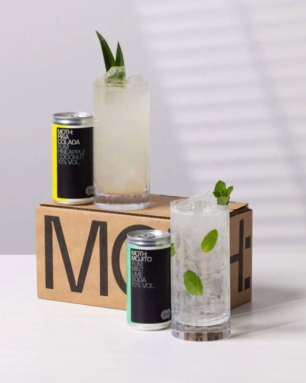 Three cocktails on a box with a striped background.