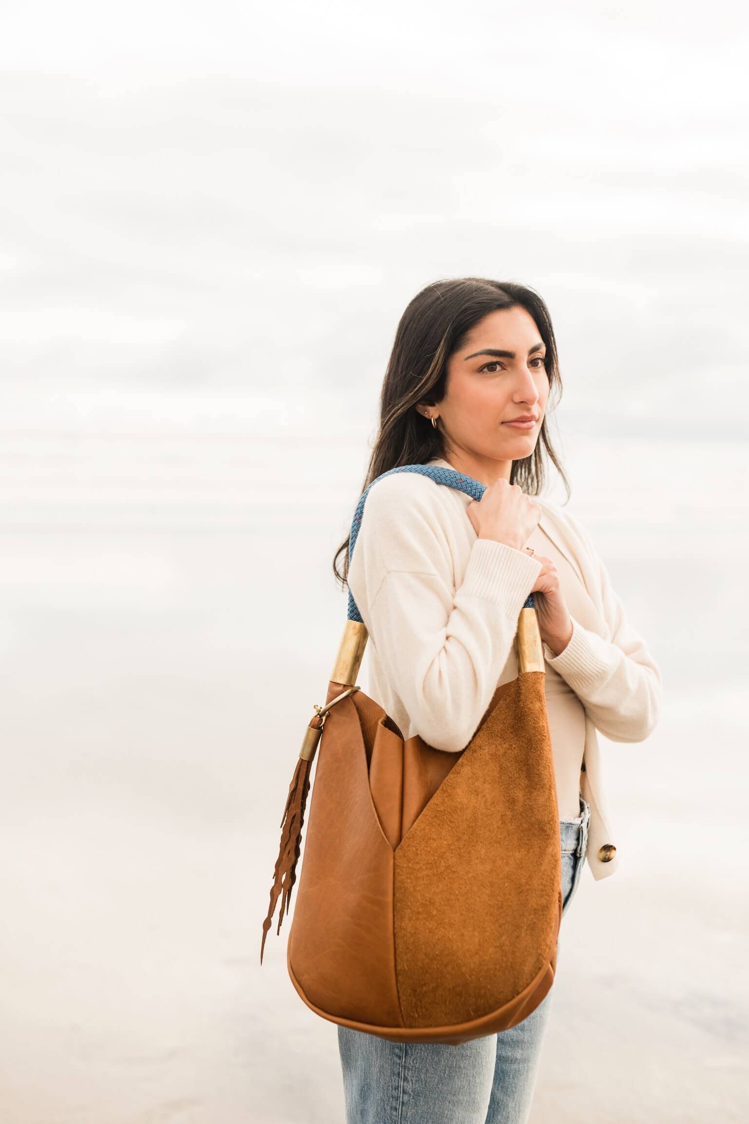 woman wearing beach nut leather original tote
