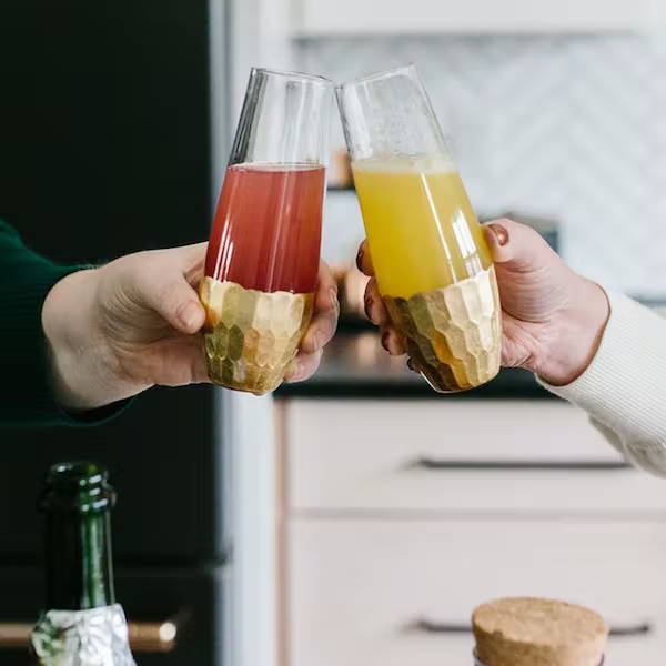 toasting with mimosas
