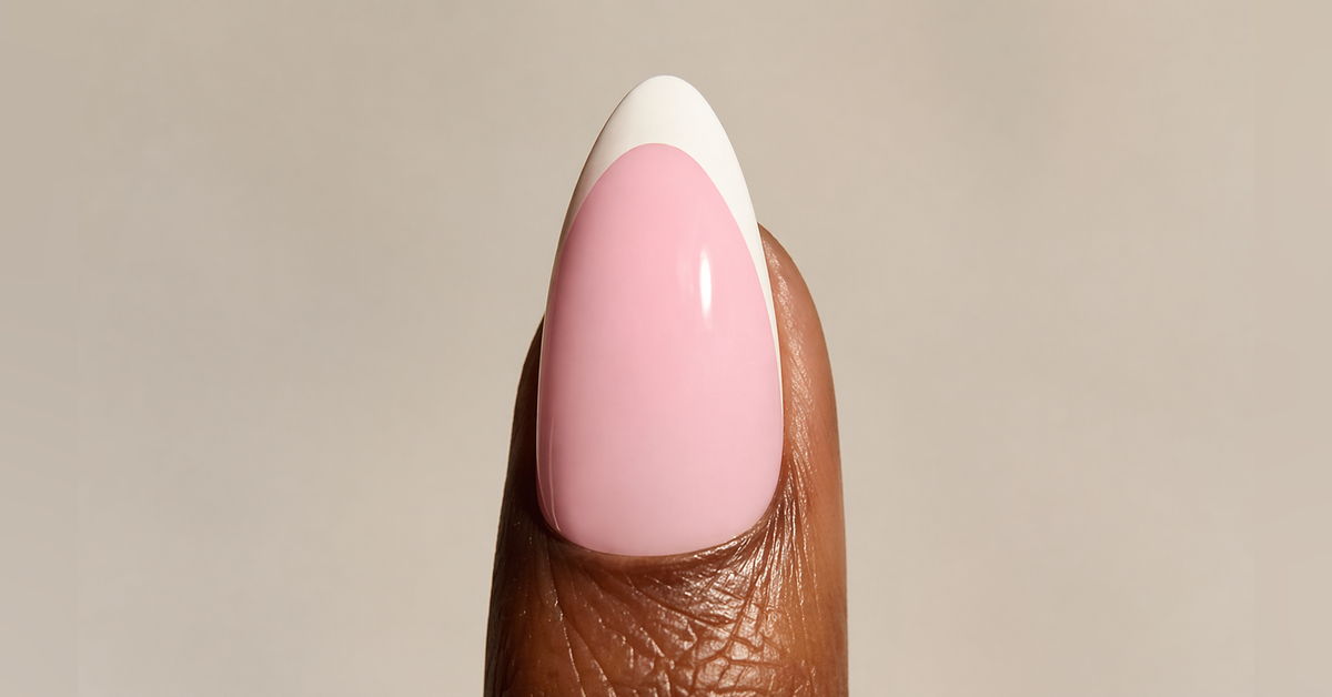 The GelBottle Inc french manicure, featured on a deep skin finger. 