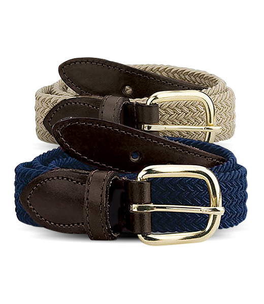 Dark blue and light tan belts in front of white background.