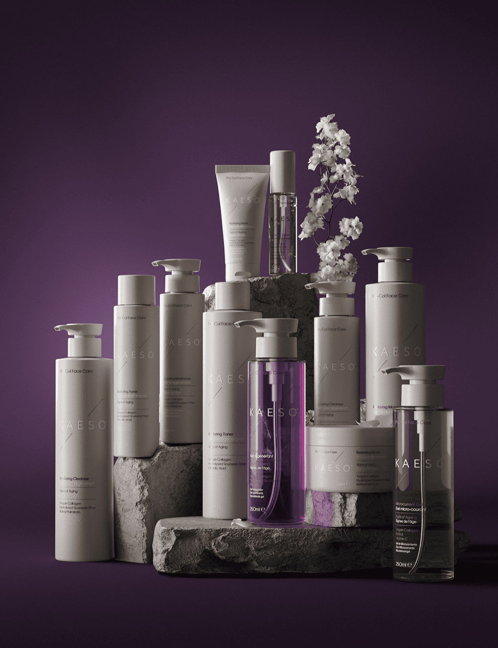 A collection of skincare products arranged on a textured surface against a purple background.
