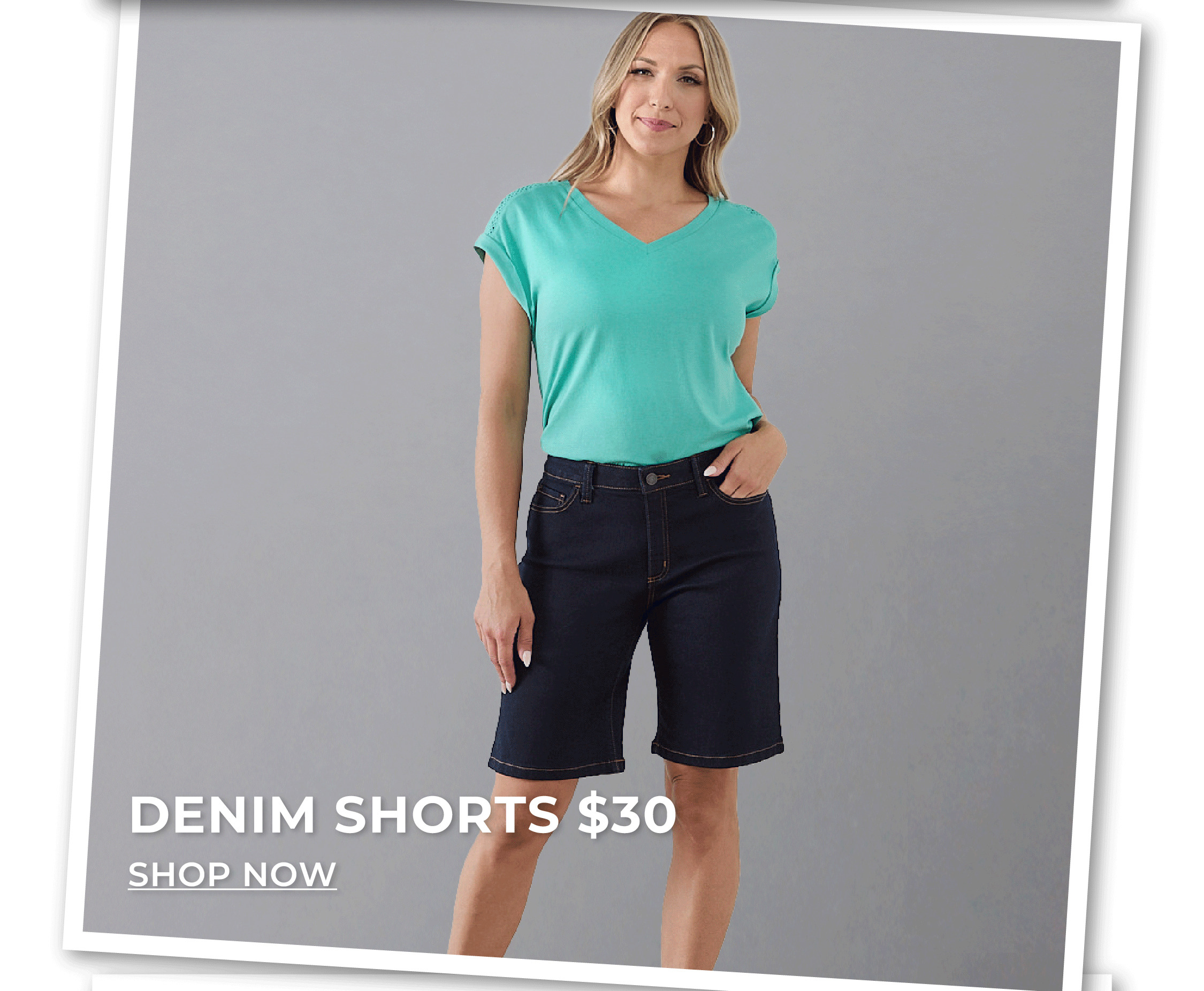 Woman standing in dark denim jeans and teal top. Denim shorts $30.