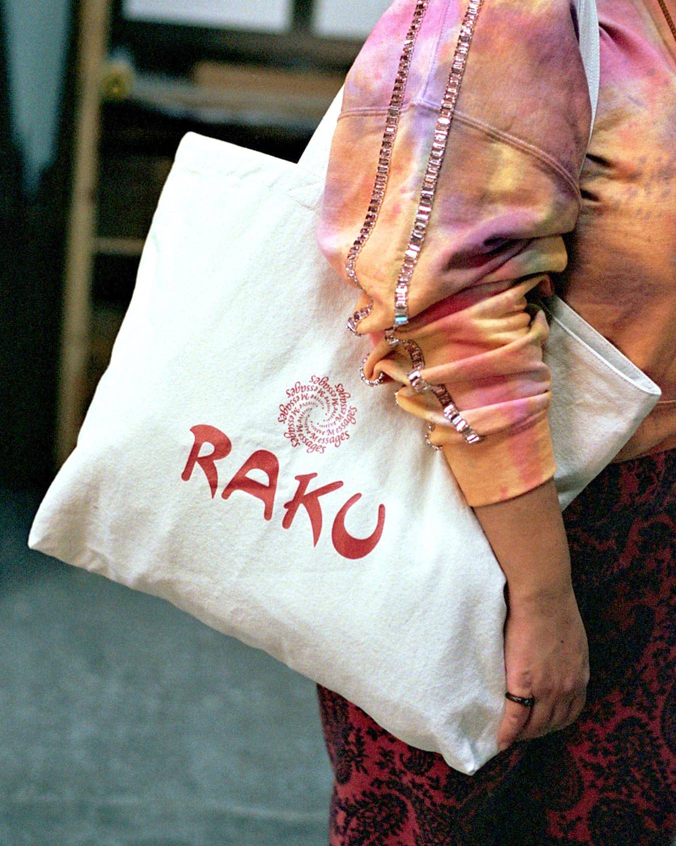 Close up image of Sara holding the A Positive Message Ikebana Tote.