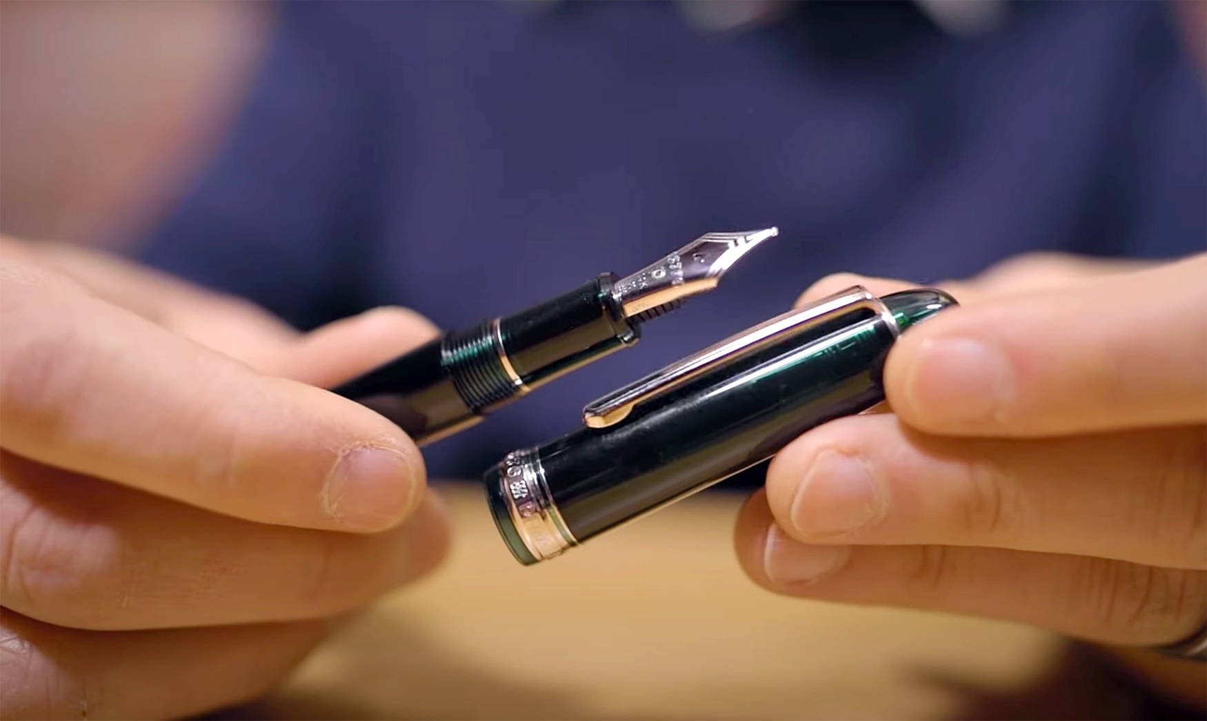 Man showing the fountain pen nib of a Pilot Custom 74 fountain pen