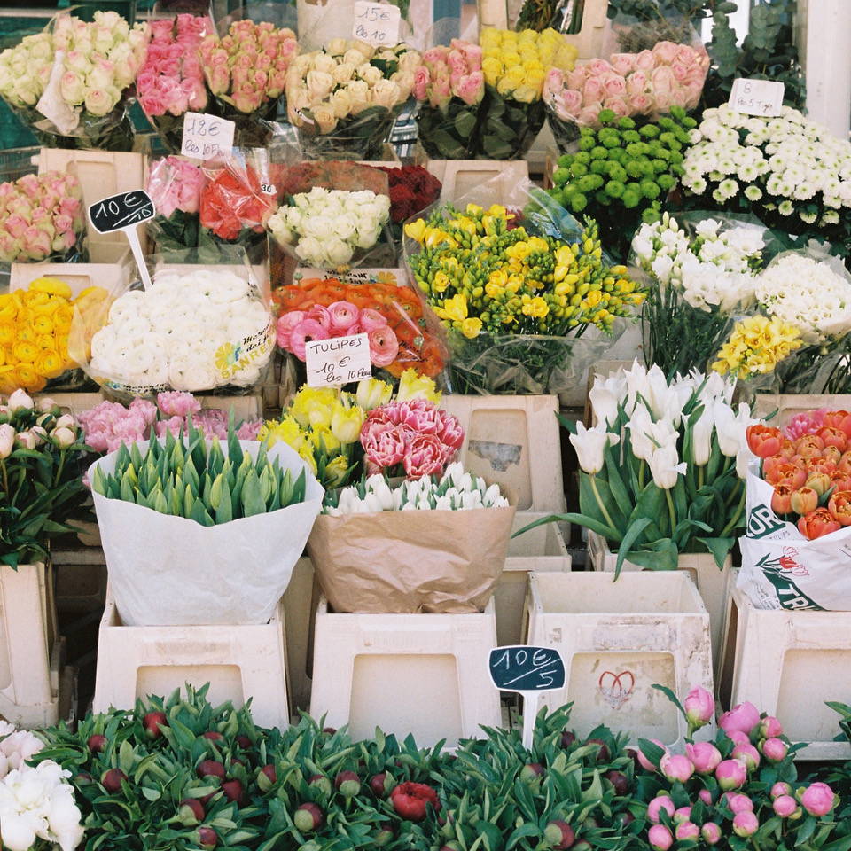 An image of a flower stall full of spring flowers.