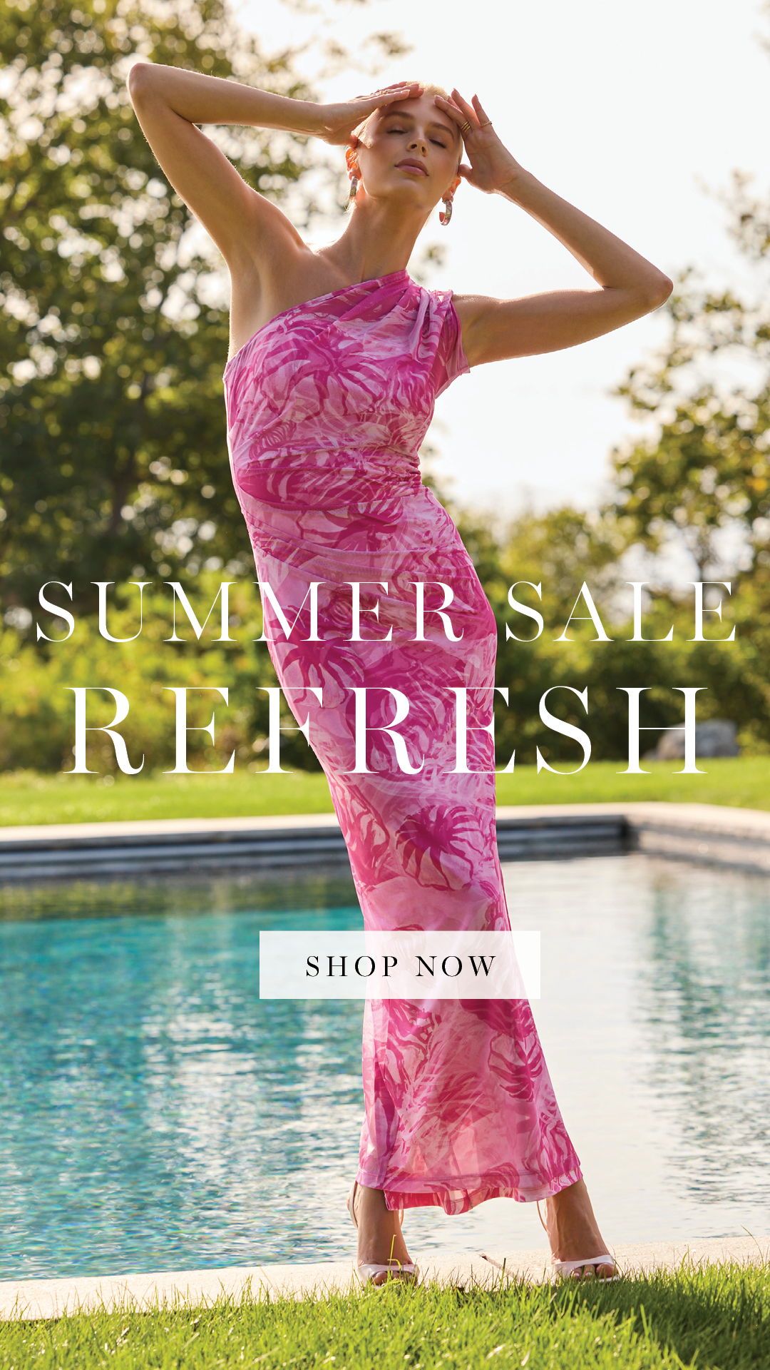 Model in a pink dress by a pool promoting summer sale.