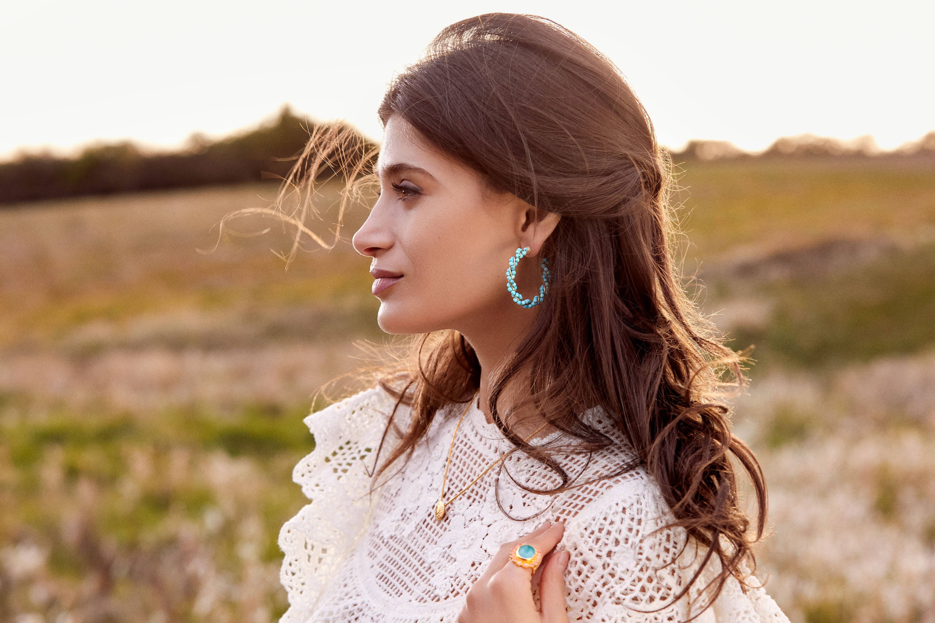 Cairo wears the Gia Turquoise Hoop Earrings and Coral and Aqua Ring