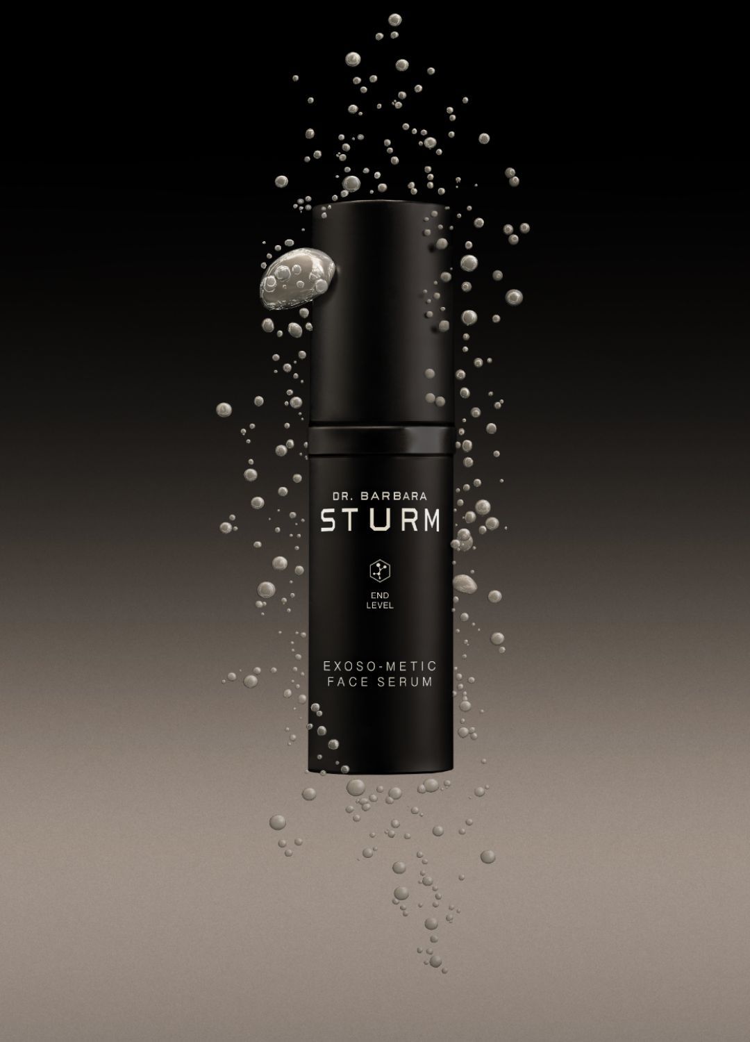 Black skincare product bottle with bubbles against a dark background.