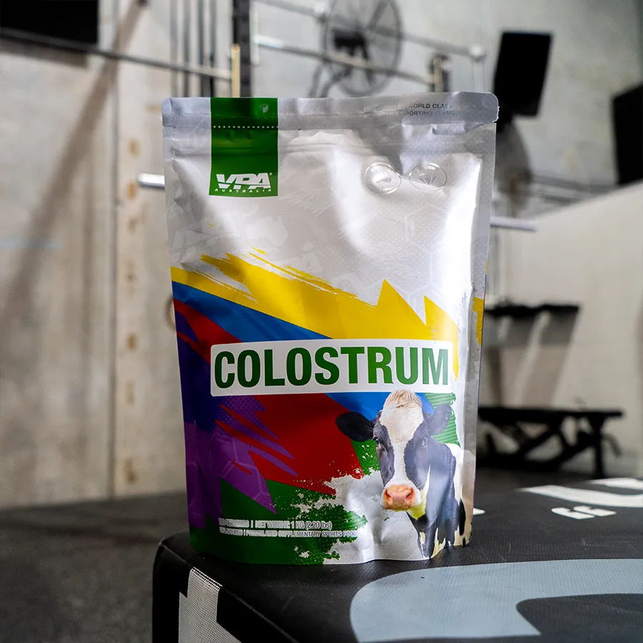 Pouch of colostrum supplement on a gym bench.