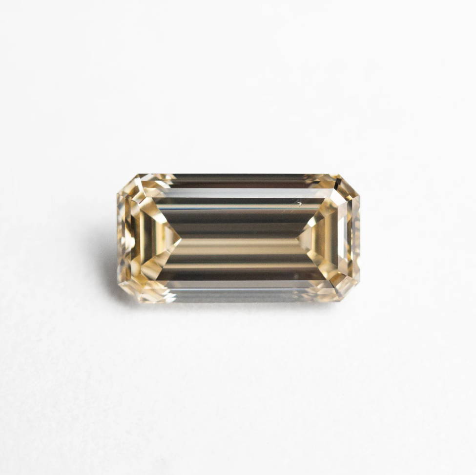 Elongated champagne emerald cut diamond