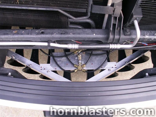 Front-side angle of Travis's 2006 Dodge Ram 1500 horn installation