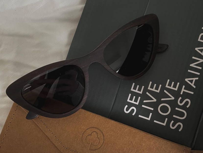 Selena, Wood eco friendly sunglasses with Kraywoods slogan under it.
