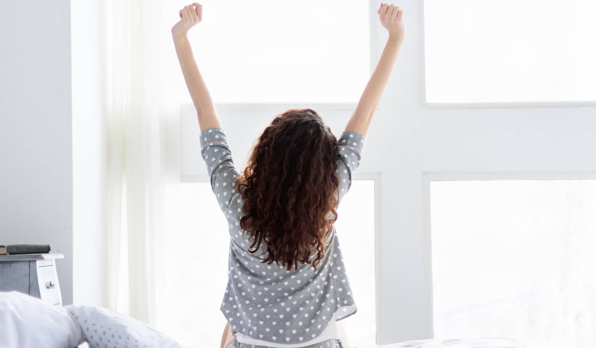 woman waking up refreshed|5 Ways To Wake up Feeling Energized in the Morning