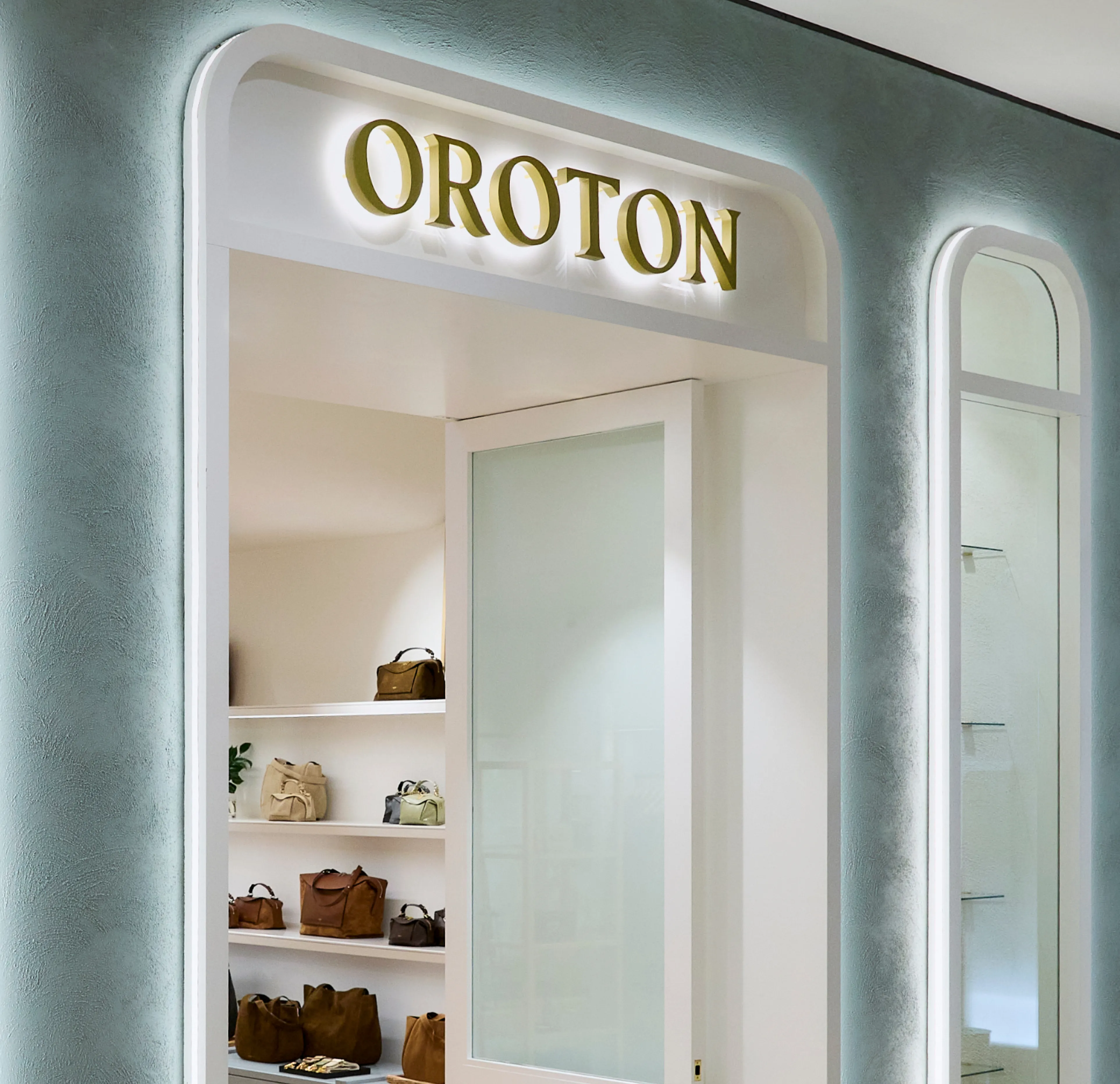 Storefront of Oroton displaying bags and accessories.