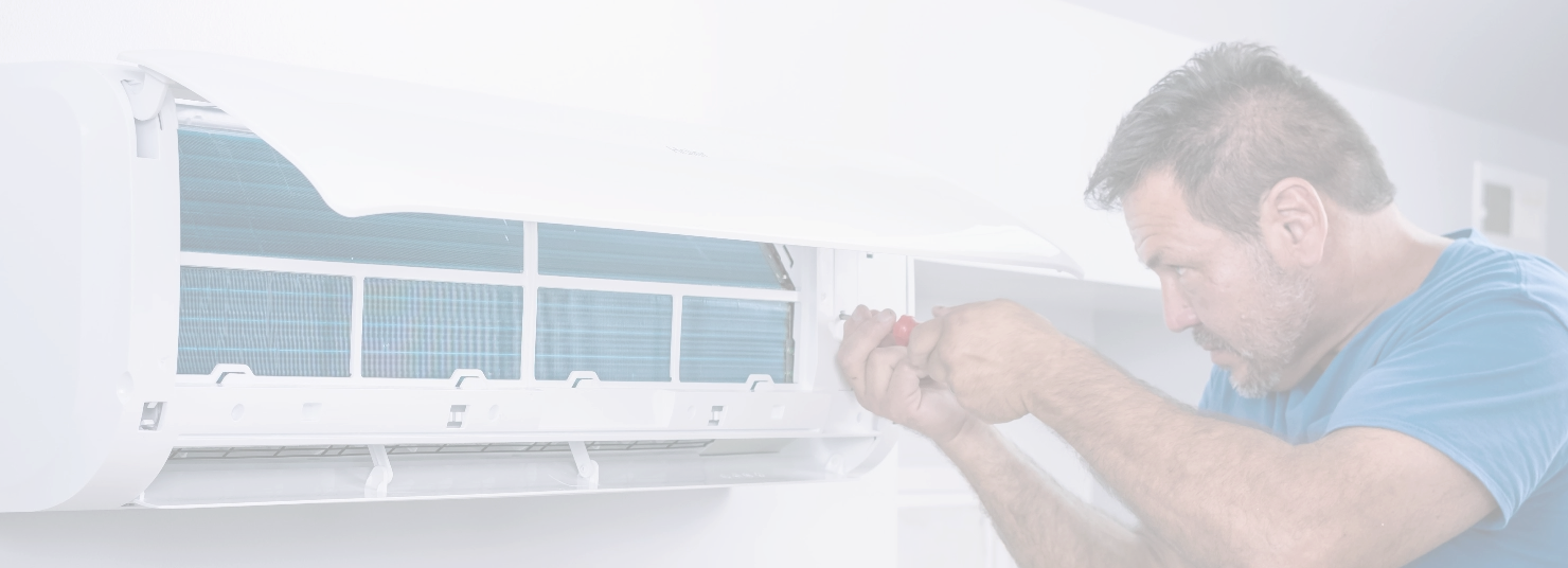 Man Installing An Indoor HVAC Unit