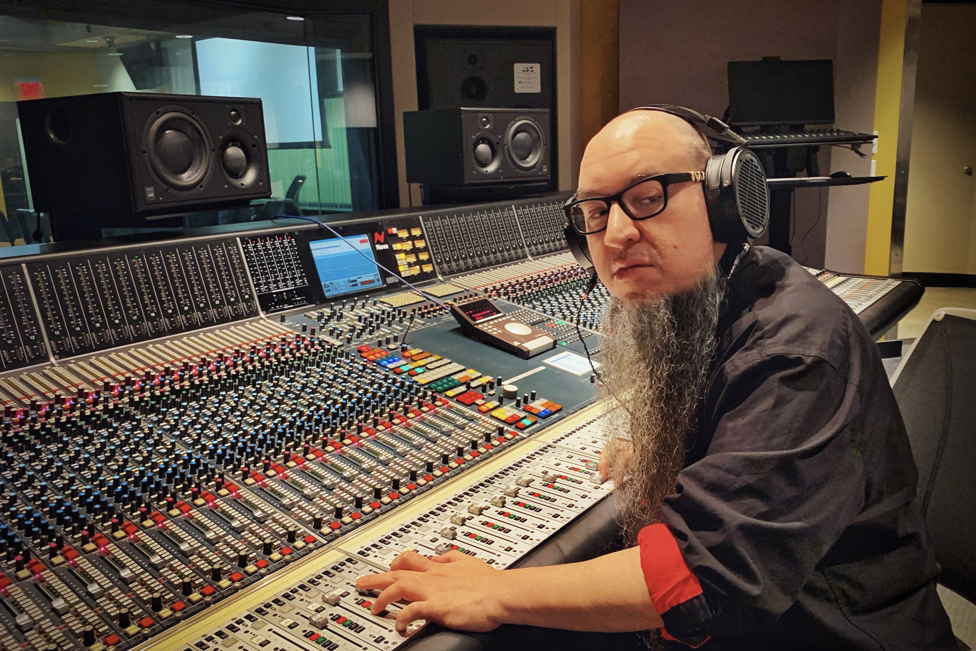 EGM wearing Audeze LCD-X headphones on the mixing console