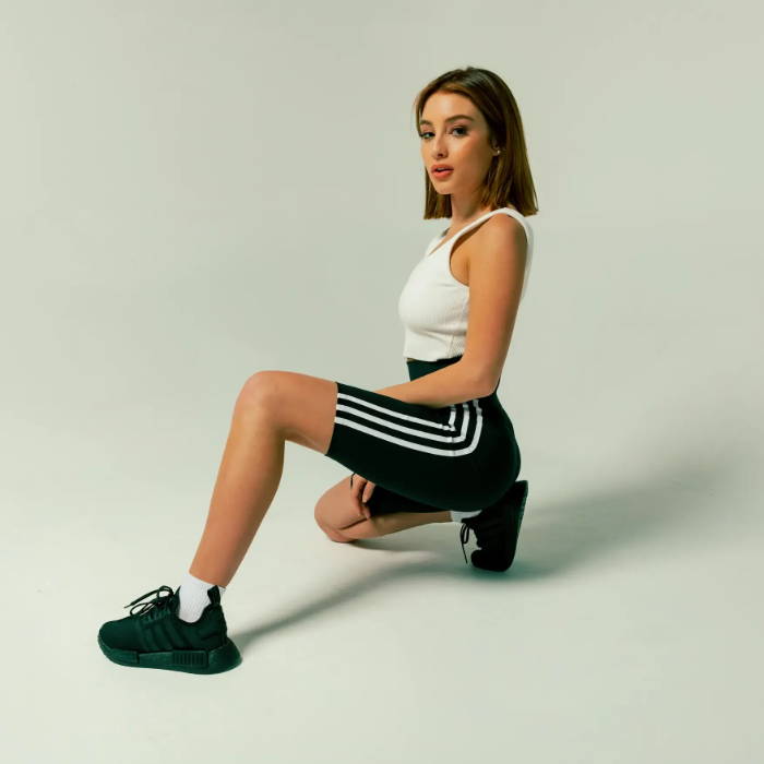 female model wearing black adidas ultraboosts