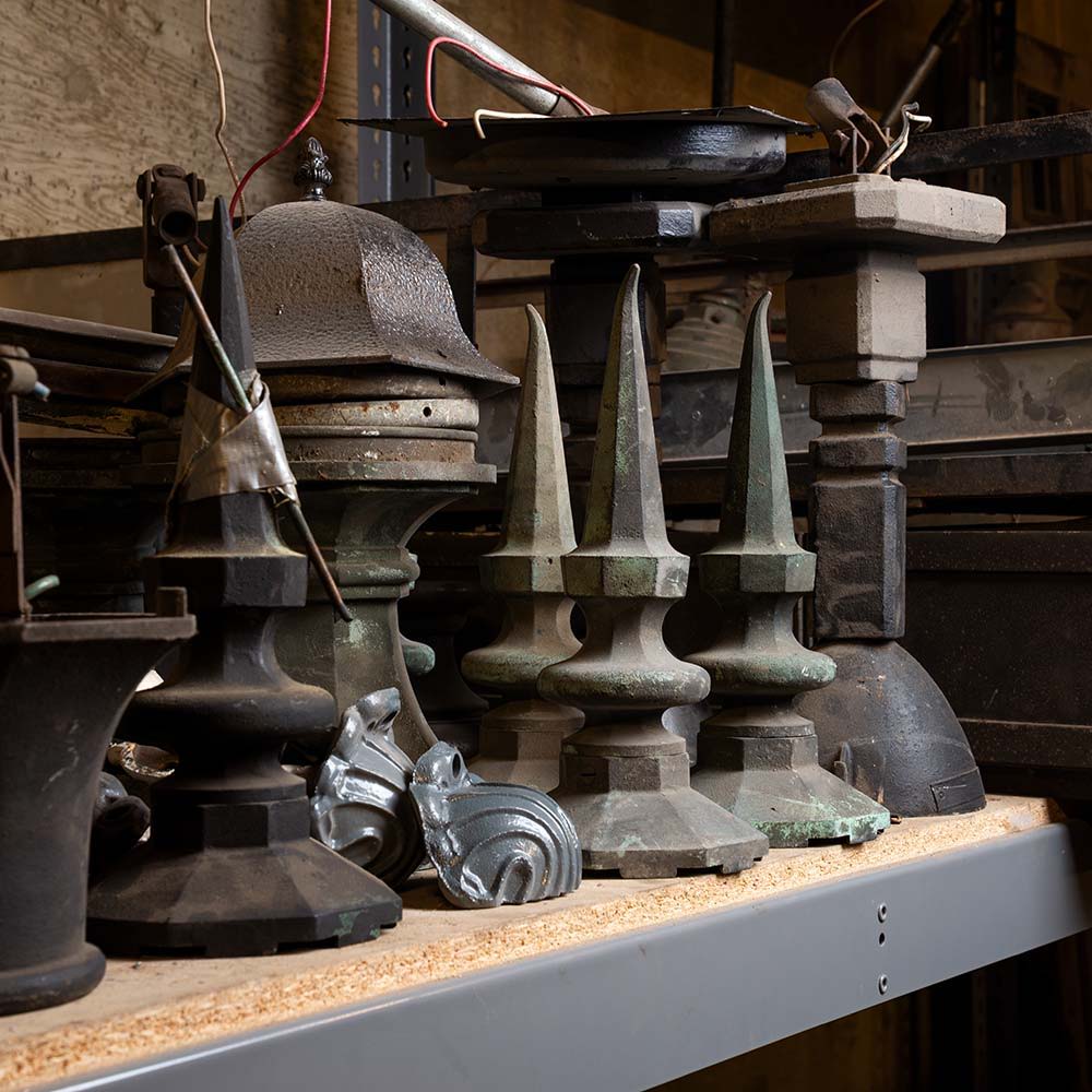 Pieces of historic light fixtures on the shelf of the clock tower archives at Los Angeles' Union Station.