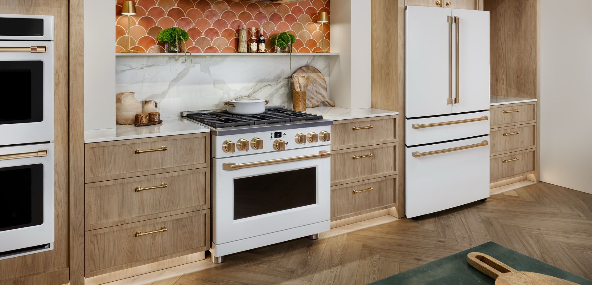 Modern kitchen featuring a white stove, refrigerator, and wooden cabinetry.