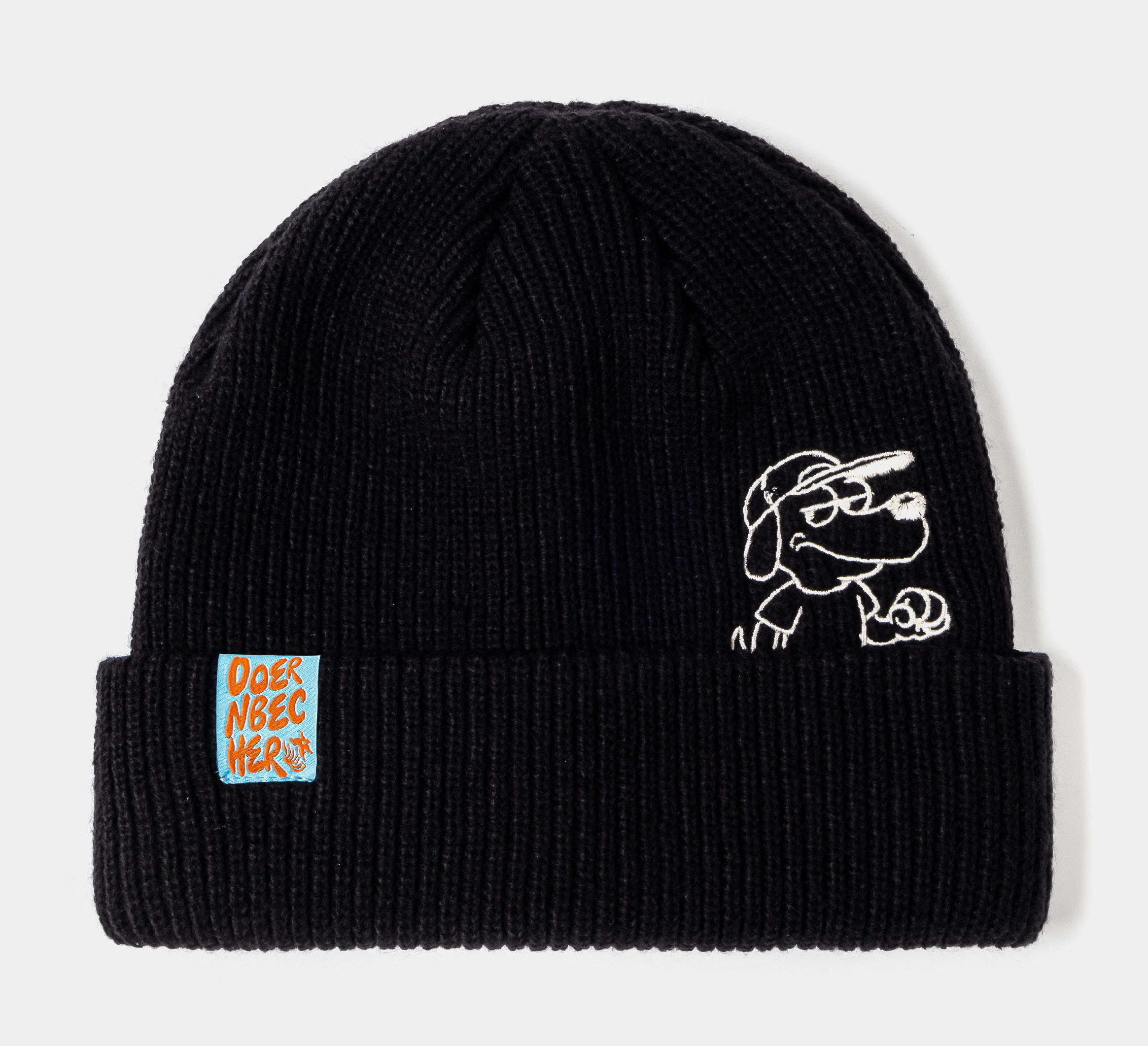 Black knit beanie with a dog design and patch logo.