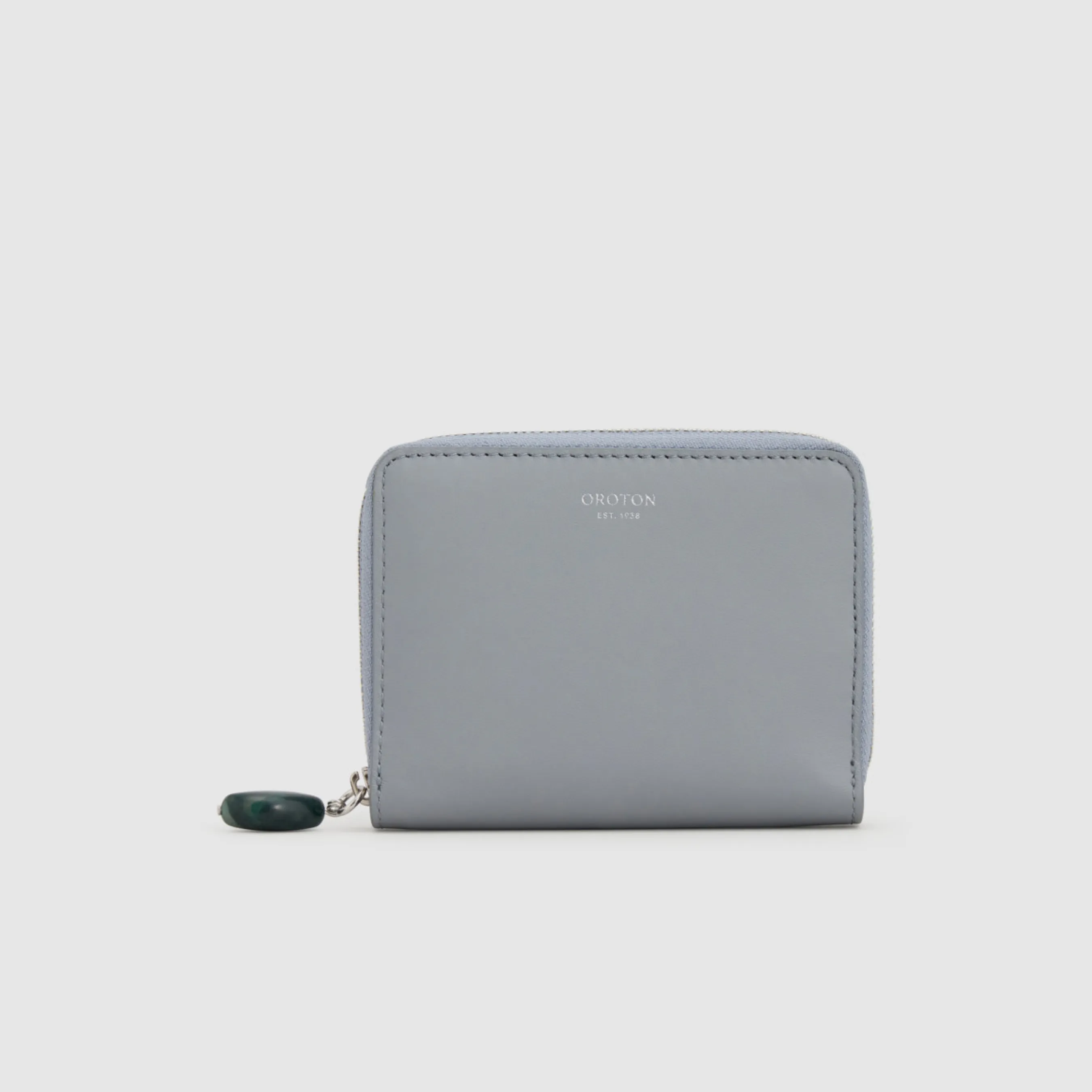 Gray wallet with zipper and green accent detail.