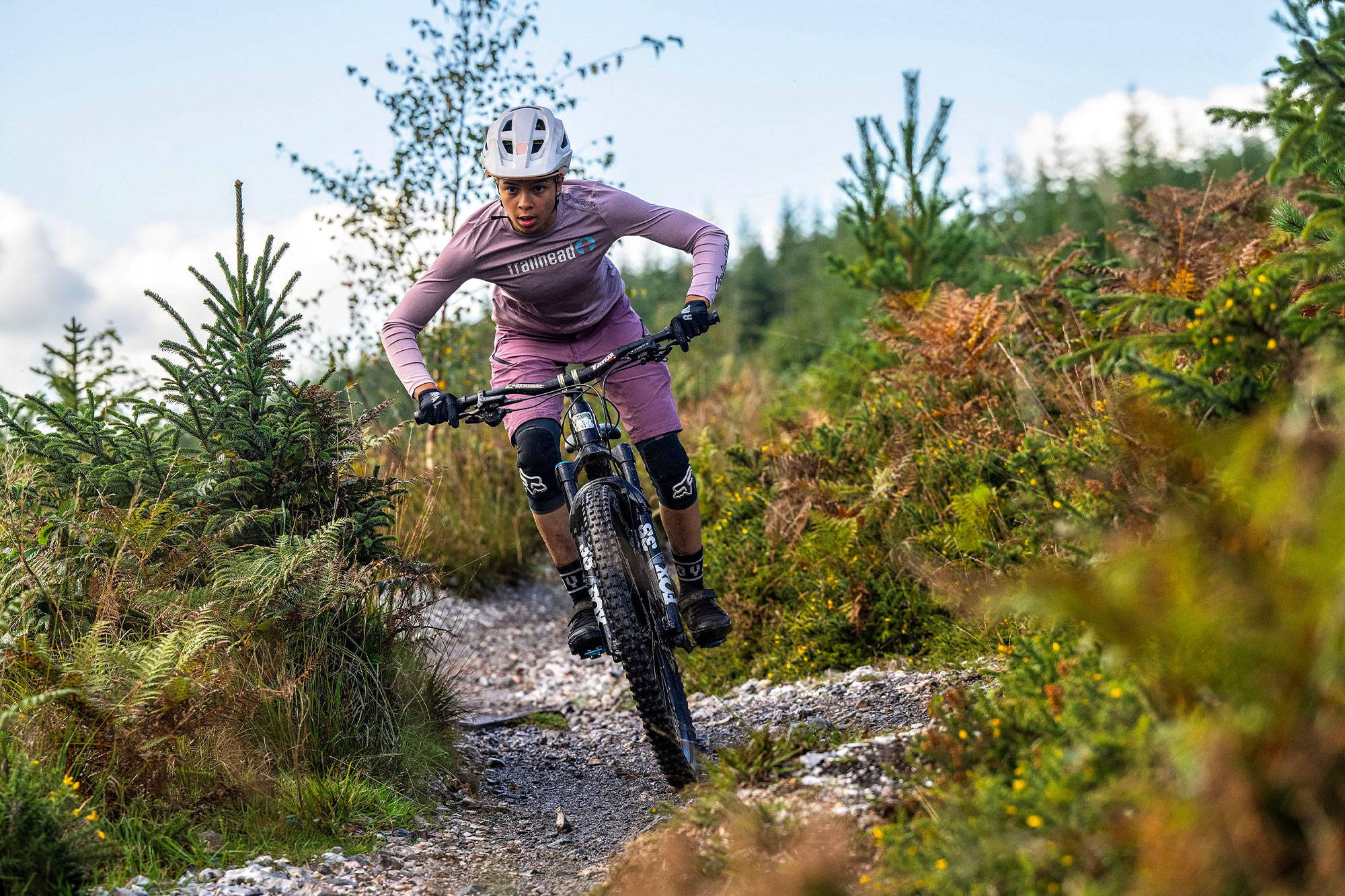 Amelia riding a trail