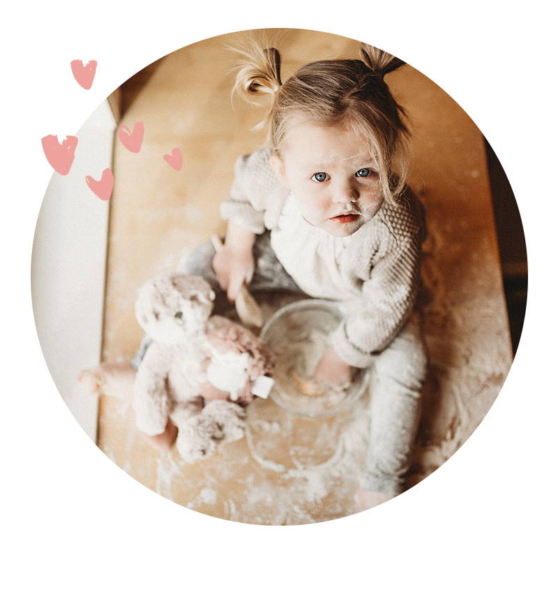Girl playing in flour with otter kin. Click to read our blog