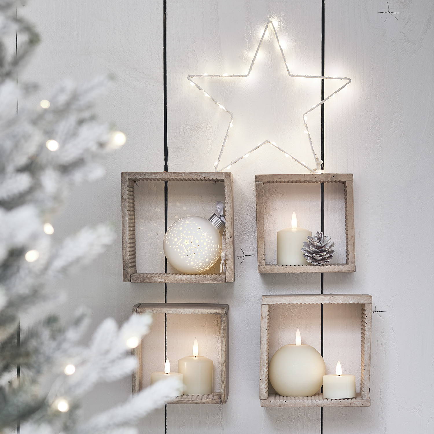 Decorative box shelves complete with LED candles,  lit baubles and a bright Osby star light