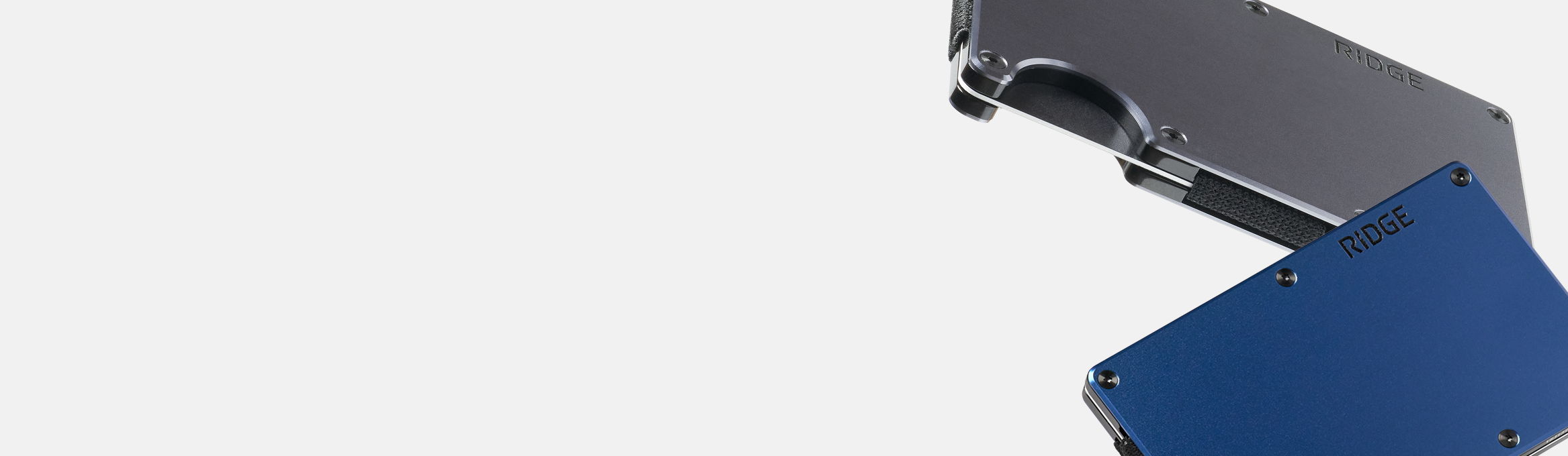 A blue and gray object partially visible on a light background.
