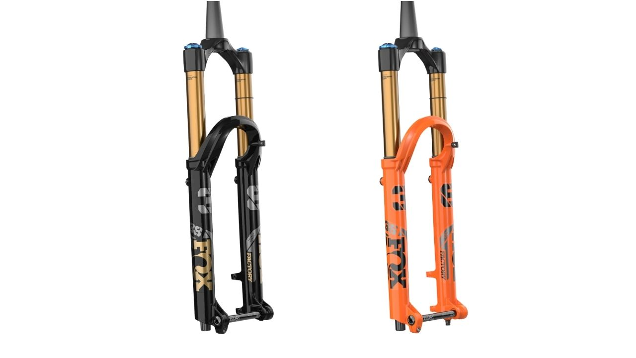 two fox factory 38 mountain bike forks with black and shiny orange paint