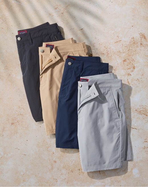 Four pairs of shorts in various colors arranged neatly.