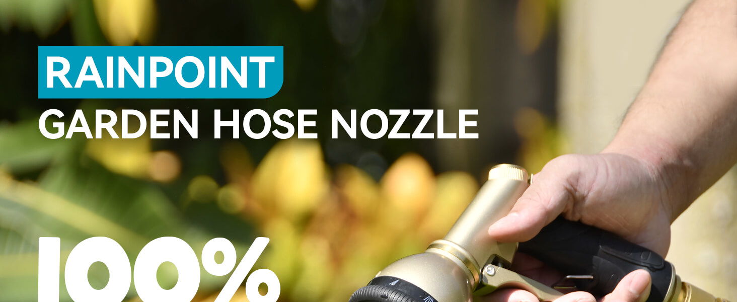 Garden hose nozzle being held with greenery in the background.