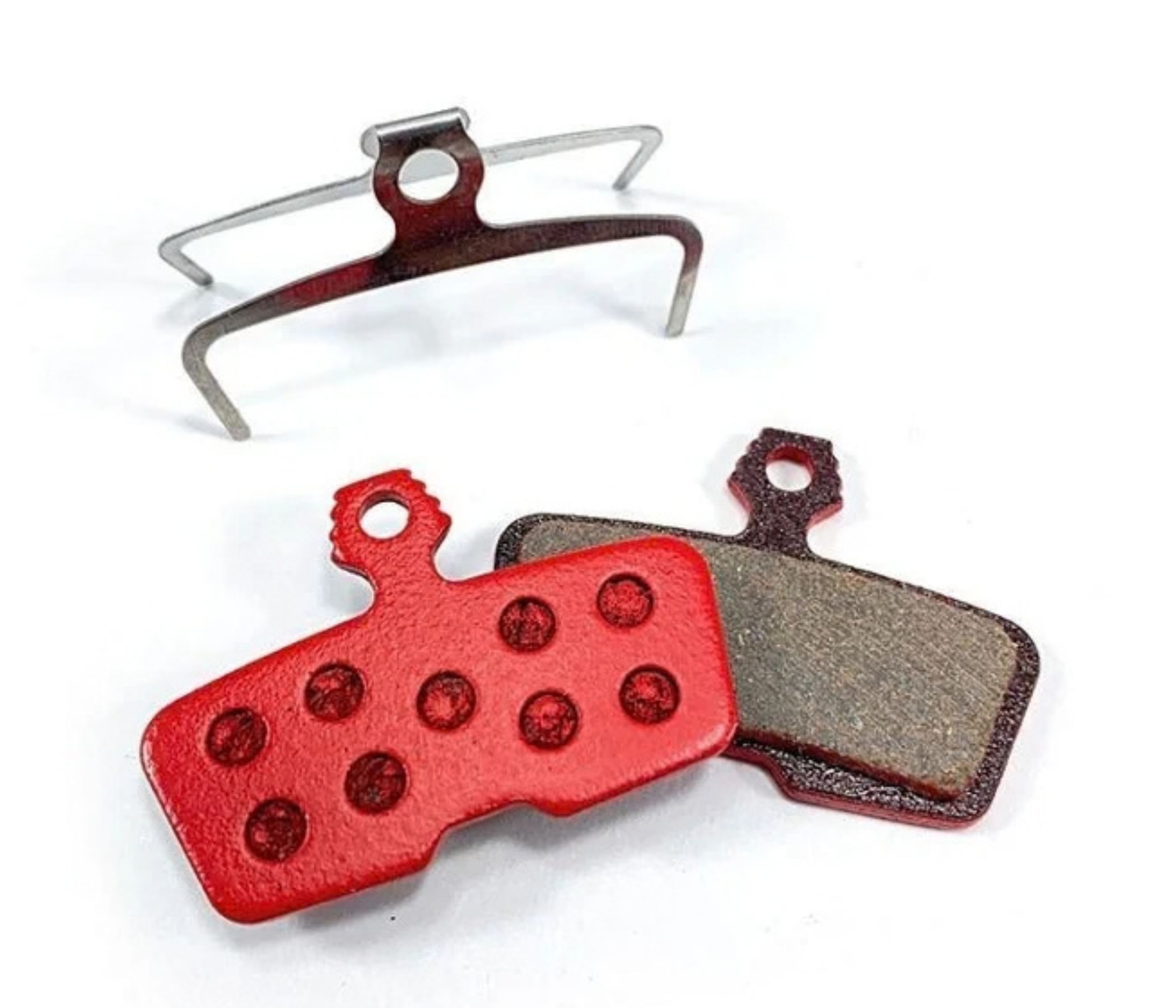 Bike brake pads and a retaining clip on a white background.