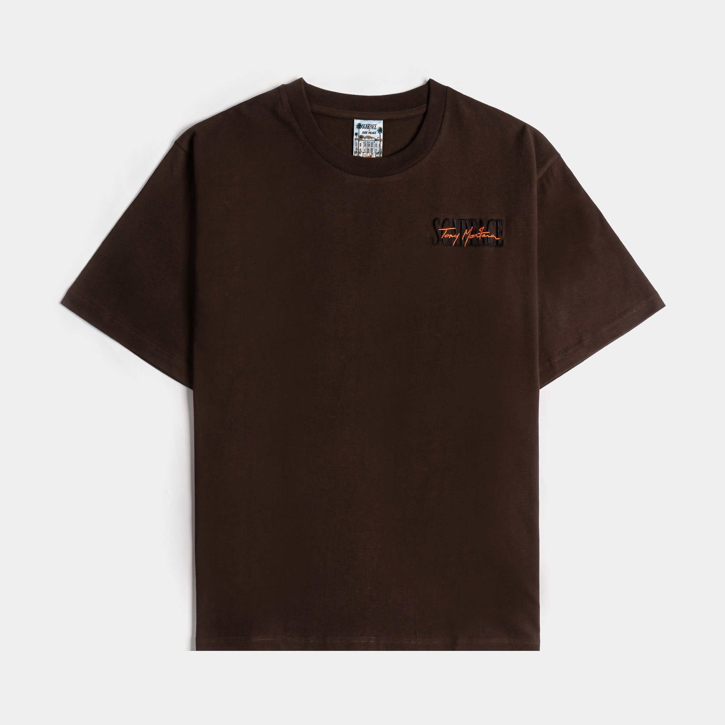 Brown t-shirt with a small logo on the front.