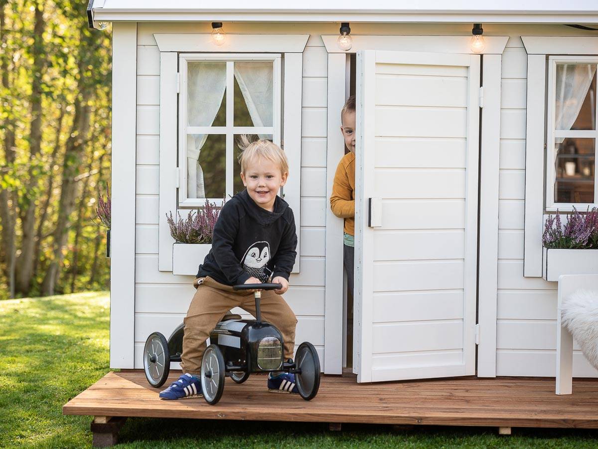 Kids outside of Kids Playhouse Arctic Nario Outdoor Playhouse by WholeWoodPlayhouses