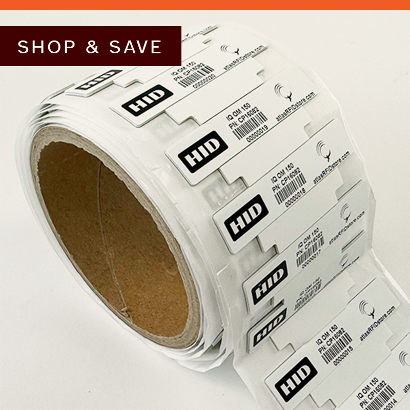 Roll of white labels with black text, partially unrolled.