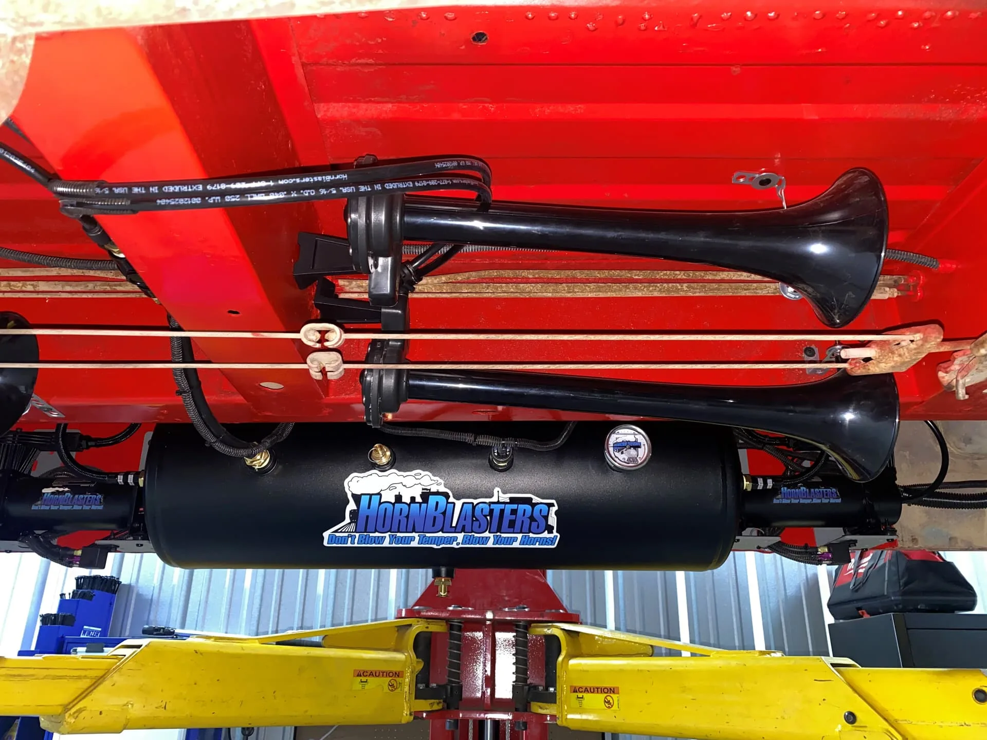 Front angle of 1970 Ford Econoline E200 with Conductor's Special 844 Nightmare Edition train horn kit HornBlasters gallery photo 3