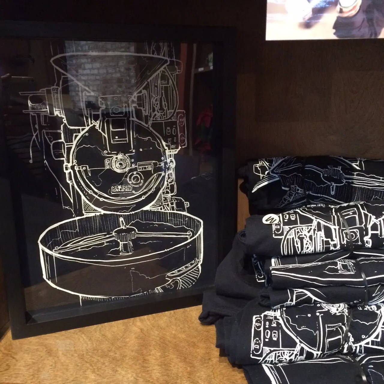 Retail Tee Shirt Display at Temple Coffee with Shart Original T-Shirt Frames