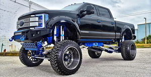 Jeff's lifted black 2017 Ford F250 Super Duty with blue suspension and chrome off-road wheels