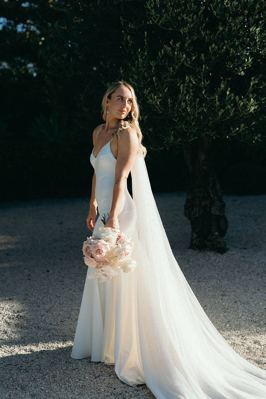 Bride, standing in the garden